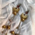 Temple-Inspired Long Gold Earrings with Red Gem Accents